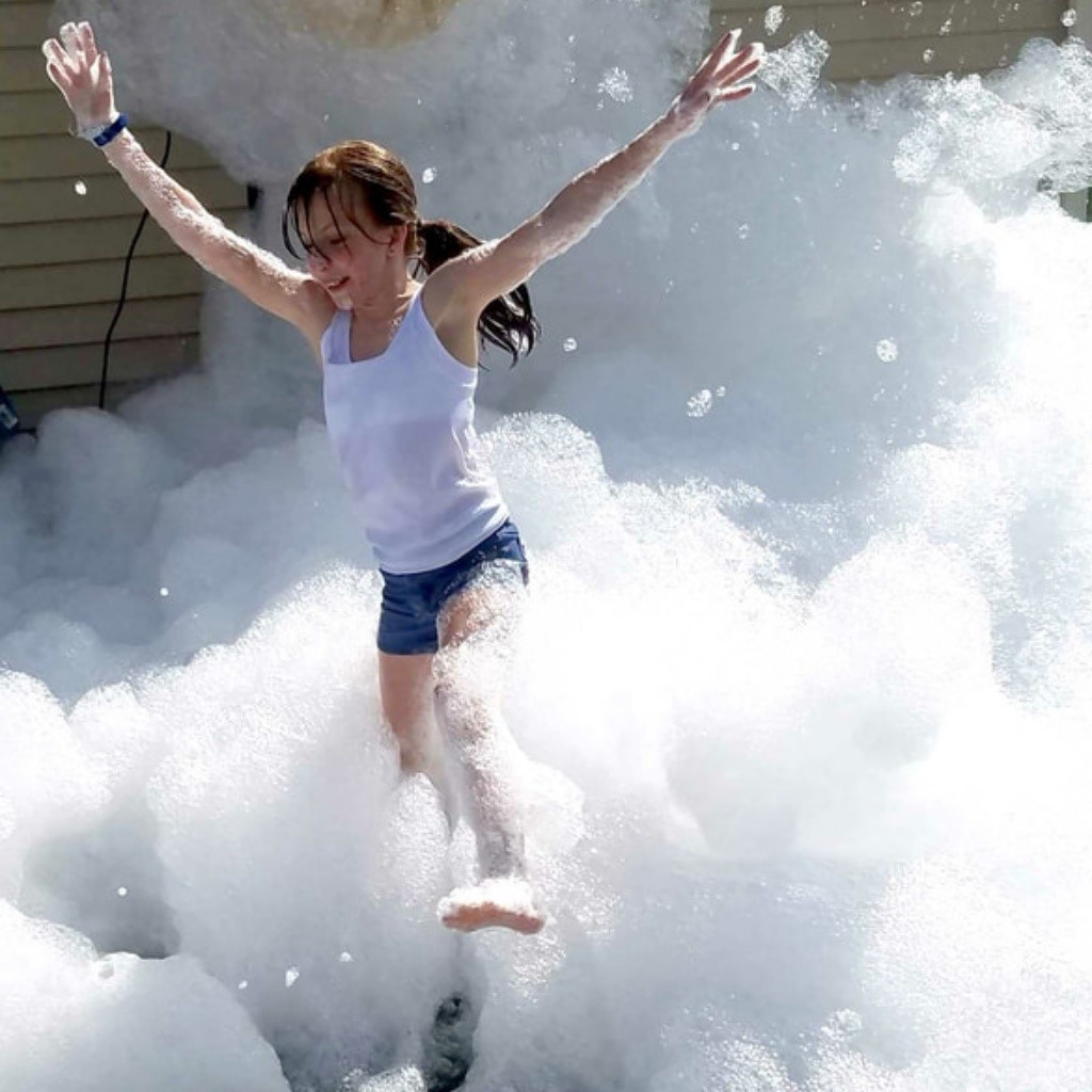 Girl in foam and bubbles