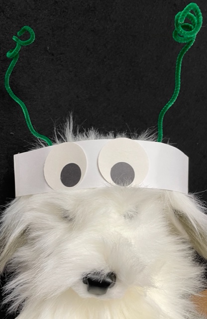 sheepdog puppet wearing bug headband
